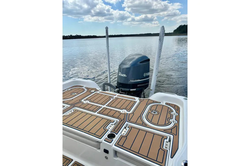 Slide: The Image of 2021 Blue Wave 2600 PureBay boat with Yamaha engine on calm water. - 21