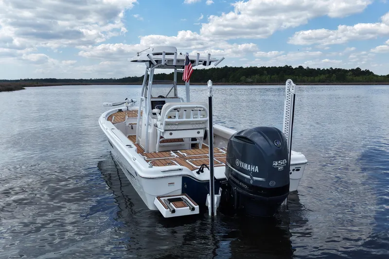 Slide: The Image of 2021 Blue Wave 2600 PureBay boat with Yamaha engine on calm water. - 9