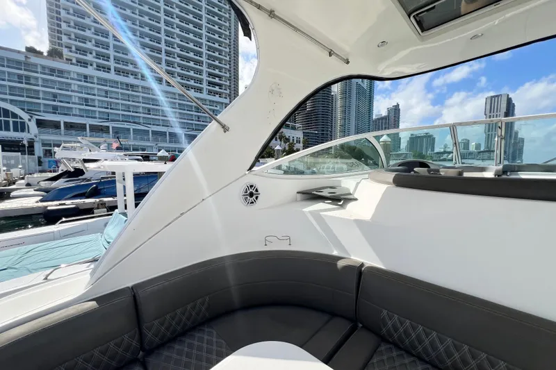 Slide: The Image of 2005 Cruisers Yachts 440 Express interior with city skyline and marina view. - 20