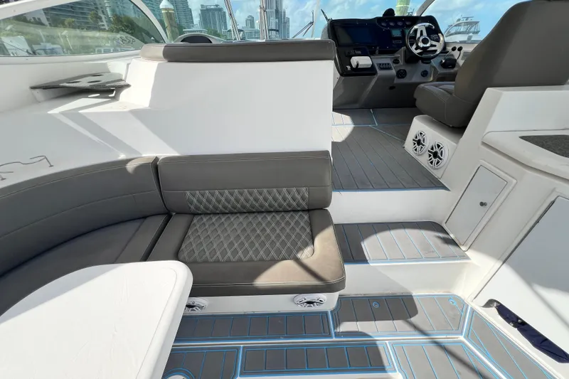 Slide: The Image of 2005 Cruisers Yachts 440 Express interior with modern seating and control panel. - 24