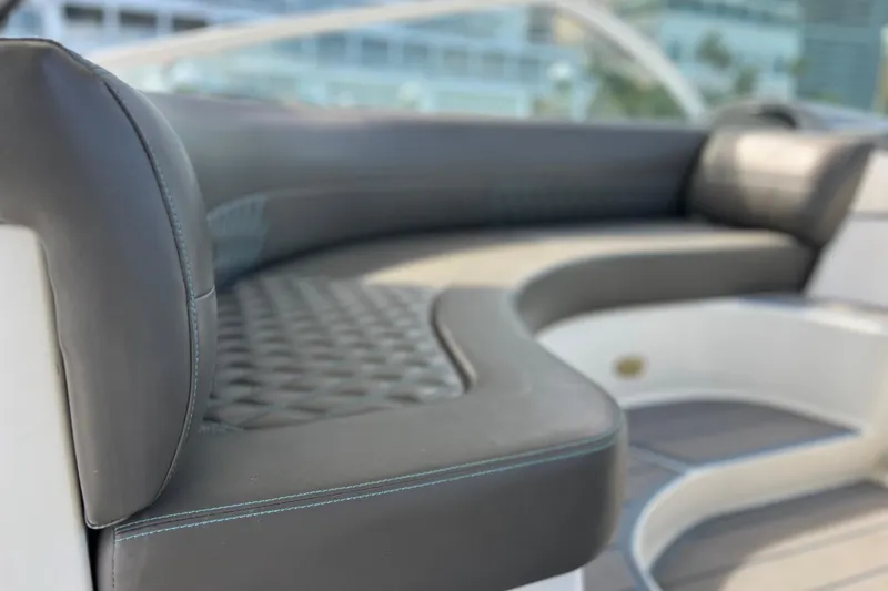 Slide: The Image of Luxurious seating on a 2005 Cruisers Yachts 440 Express boat, featuring elegant upholstery. - 29