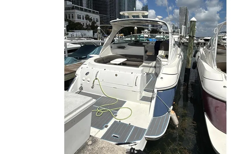 Slide: The Image of 2005 Cruisers Yachts 440 Express docked, modern design. - 3