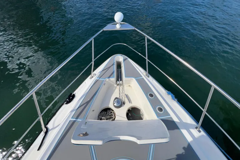 Slide: The Image of Bow view of 2005 Cruisers Yachts 440 Express on calm water. - 43