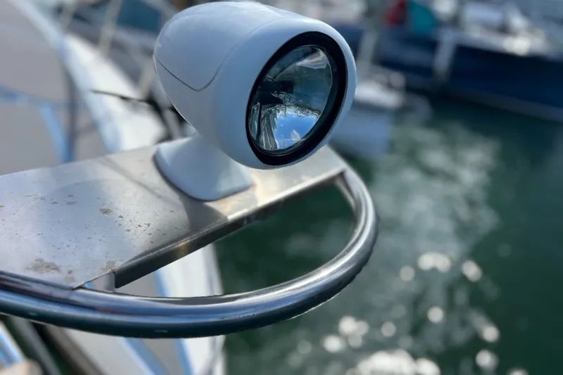 Slide: The Image of Close-up of a 2005 Cruisers Yachts 440 Express spotlight on a stainless steel railing. - 44