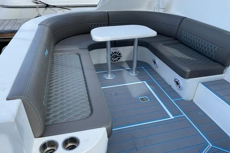Slide: The Image of Luxurious seating area on a 2005 Cruisers Yachts 440 Express with modern upholstery and table. - 5