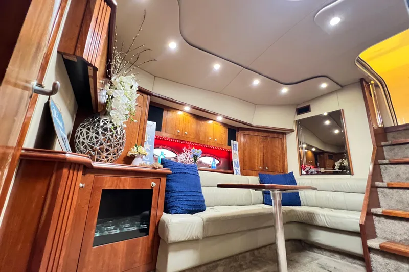 Slide: The Image of Luxurious interior of 2005 Cruisers Yachts 440 Express with elegant seating and decor. - 54