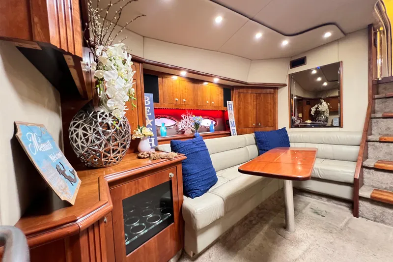 Slide: The Image of Luxurious 2005 Cruisers Yachts 440 Express interior with elegant seating and decor. - 55