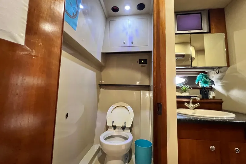 Slide: The Image of Luxurious bathroom in 2005 Cruisers Yachts 440 Express with modern amenities. - 65