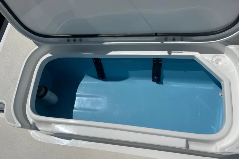 Slide: The Image of Open storage compartment in 2026 Shallow Sport 25 X3 boat. - 31