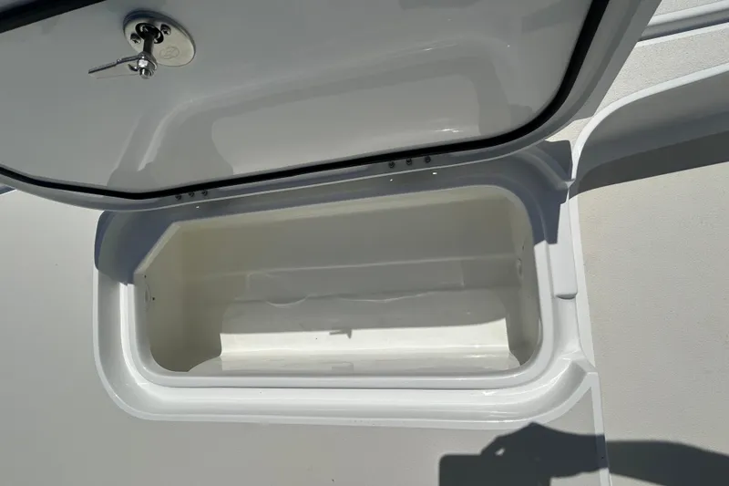 Slide: The Image of Open storage compartment on a 2026 Shallow Sport 25 X3 boat. - 45
