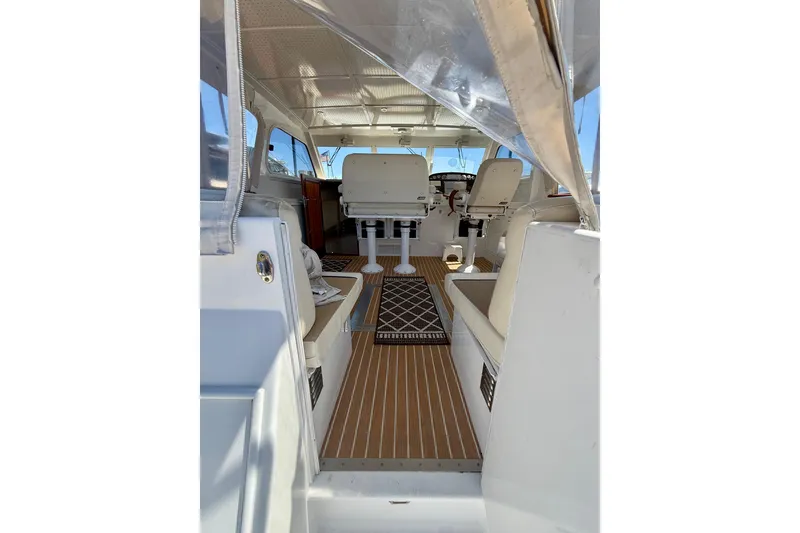 Slide: The Image of Interior view of 2006 Huckins Atlantic 44 yacht, featuring seating and helm area. - 23