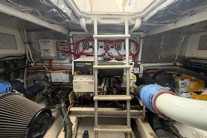 Slide: The Image of Engine room of a 2006 Huckins Atlantic 44 with Cummins Onan generator. - 28