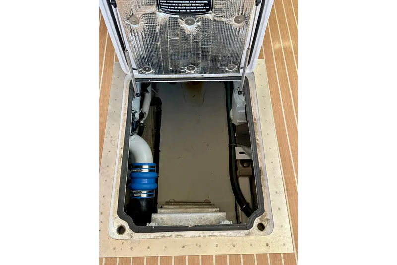 Slide: The Image of Engine compartment of a 2006 Huckins Atlantic 44 yacht, showcasing interior components. - 31