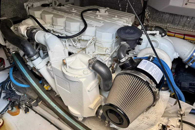 Slide: The Image of Engine compartment of a 2006 Huckins Atlantic 44 yacht, showcasing detailed mechanical components. - 33