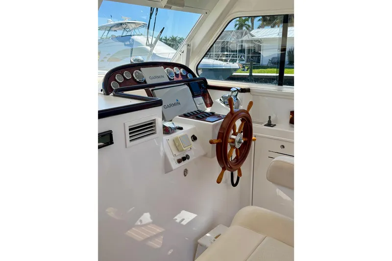 Slide: The Image of Helm of 2006 Huckins Atlantic 44 yacht with Garmin navigation system. - 36