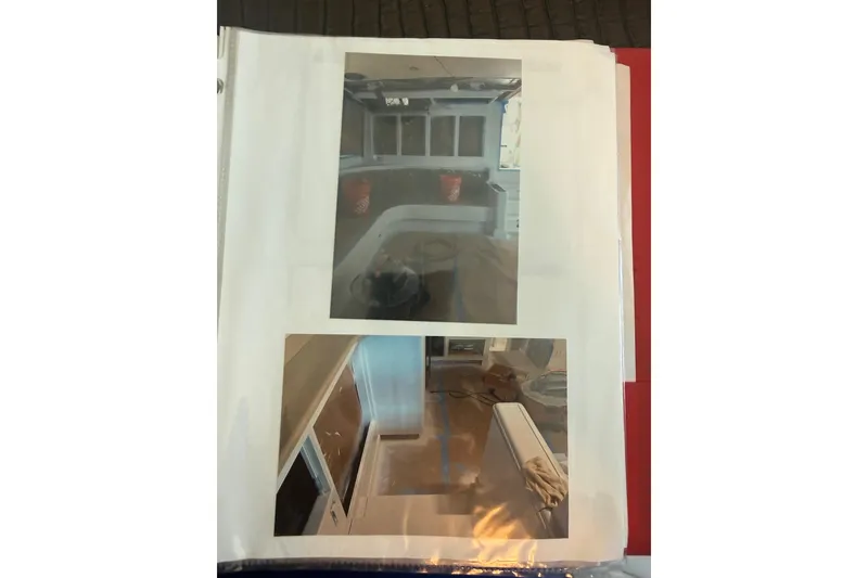 Slide: The Image of Interior photos of a 2006 Huckins Atlantic 44 yacht, showcasing seating and cabinetry. - 37