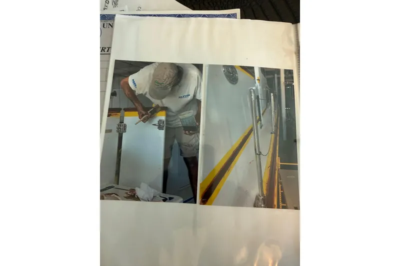 Slide: The Image of Person working on Huckins Atlantic 44 yacht, 2006 model, with tools and equipment. - 41