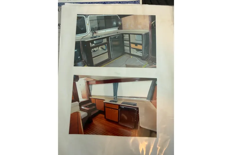 Slide: The Image of Interior views of a 2006 Huckins Atlantic 44 yacht, showcasing kitchen and seating areas. - 43