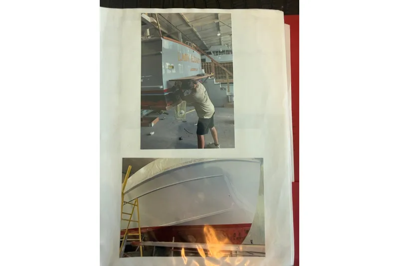 Slide: The Image of 2006 Huckins Atlantic 44 yacht in maintenance, showing hull and worker in a boatyard. - 45