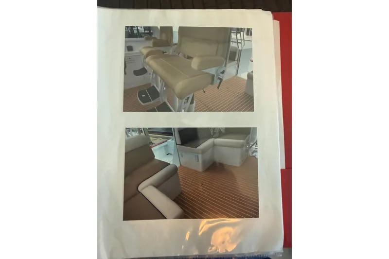 Slide: The Image of Interior seating of 2006 Huckins Atlantic 44 yacht with beige upholstery and wooden flooring. - 46