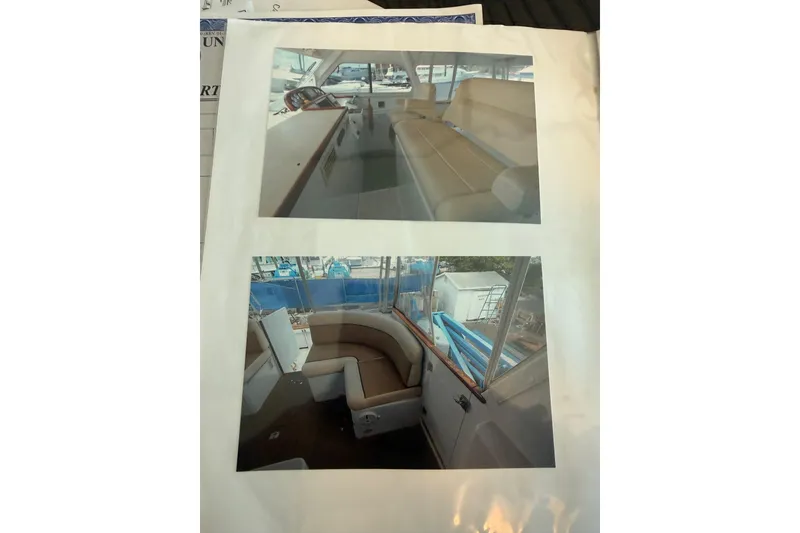 Slide: The Image of Interior views of a 2006 Huckins Atlantic 44 yacht, showcasing seating and helm area. - 49