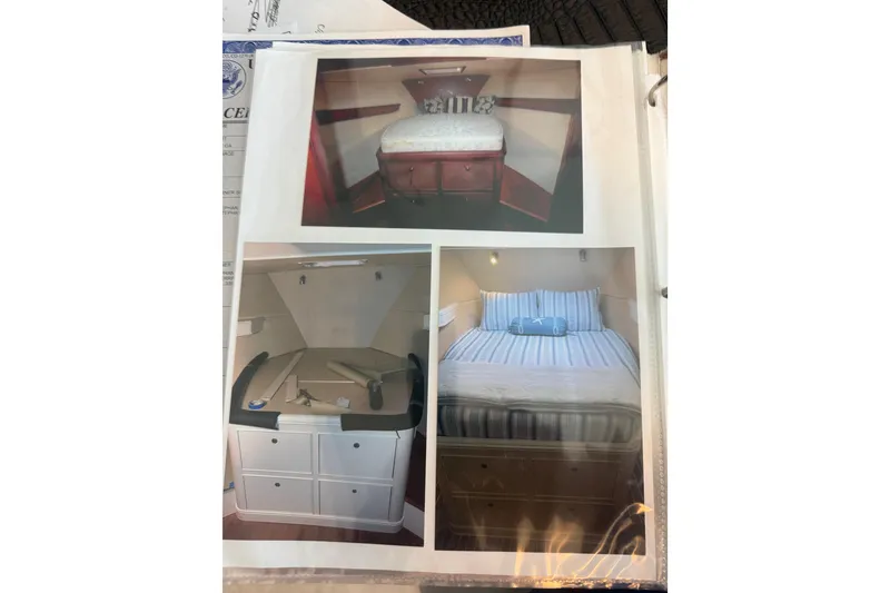 Slide: The Image of Interior views of a 2006 Huckins Atlantic 44 yacht, showcasing cozy sleeping quarters. - 56