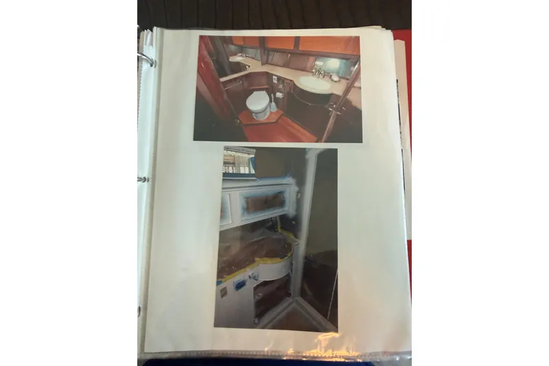 Slide: The Image of Interior views of a 2006 Huckins Atlantic 44 yacht, showcasing bathroom and kitchen areas. - 59