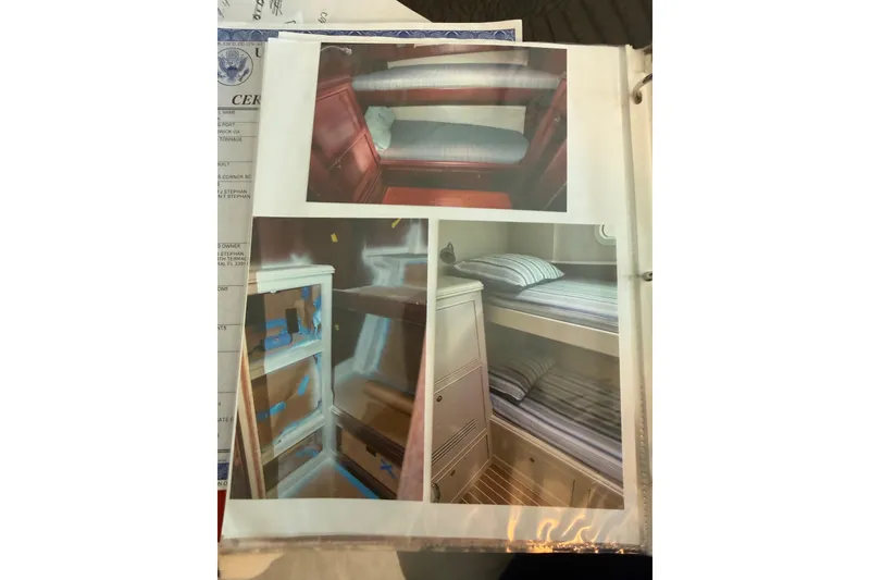 Slide: The Image of Interior of 2006 Huckins Atlantic 44 yacht showing cozy bunk beds and storage. - 60