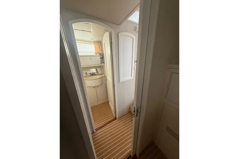 Slide: The Image of Interior view of 2006 Huckins Atlantic 44 yacht bathroom with striped flooring. - 63