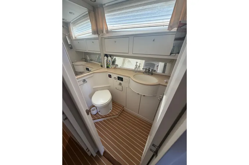 Slide: The Image of Luxurious bathroom in 2006 Huckins Atlantic 44 yacht with modern fixtures and wood flooring. - 69