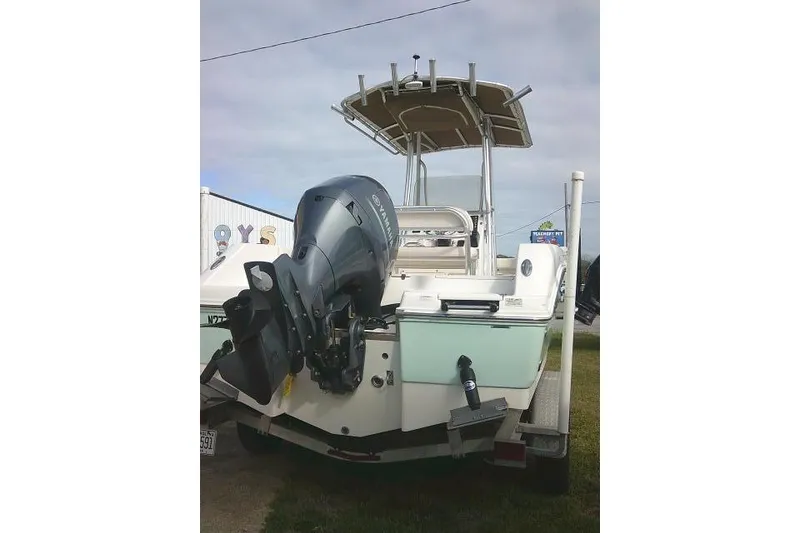 Slide: The Image of 2016 Robalo R200 Center Console boat with Yamaha outboard motor, parked on grass. - 10