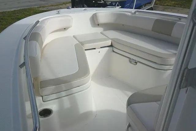 Slide: The Image of 2016 Robalo R200 Center Console boat interior with cushioned seating. - 16