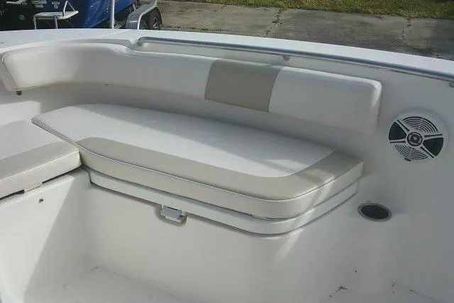 Slide: The Image of 2016 Robalo R200 Center Console boat interior with cushioned seating and speaker. - 17