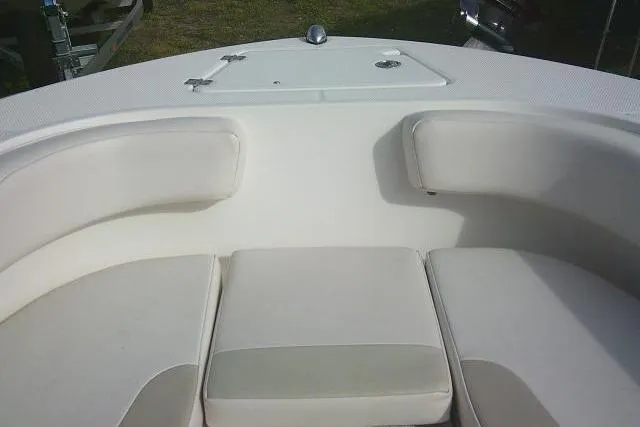 Slide: The Image of 2016 Robalo R200 Center Console boat interior with cushioned seating. - 18