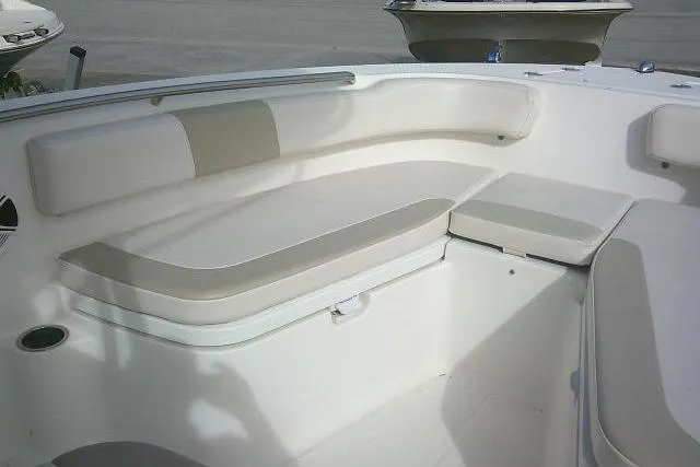 Slide: The Image of 2016 Robalo R200 Center Console boat interior with cushioned seating. - 19