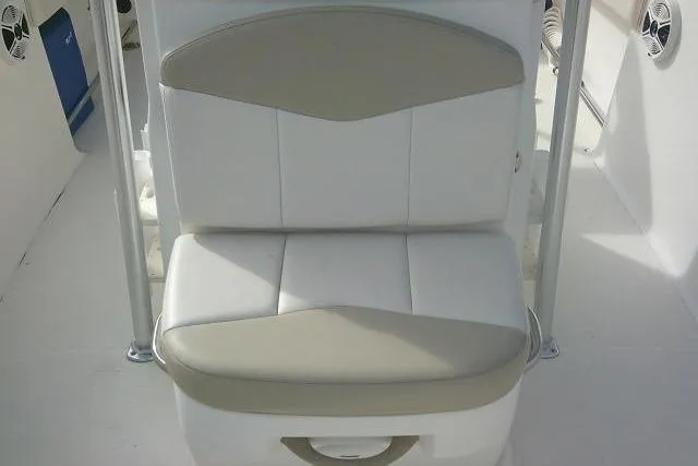 Slide: The Image of 2016 Robalo R200 Center Console boat seat, white and beige upholstery. - 20