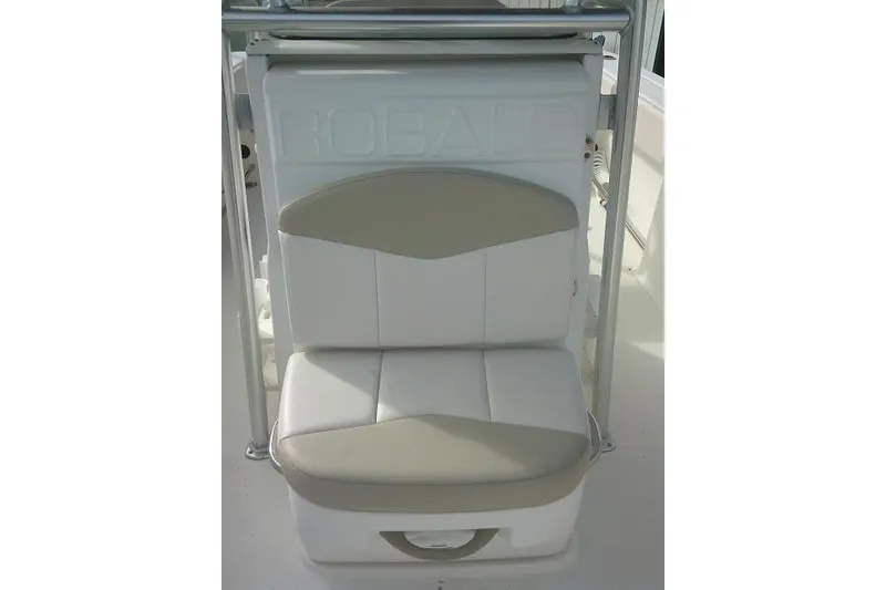 Slide: The Image of 2016 Robalo R200 Center Console boat seat with white and beige upholstery. - 21
