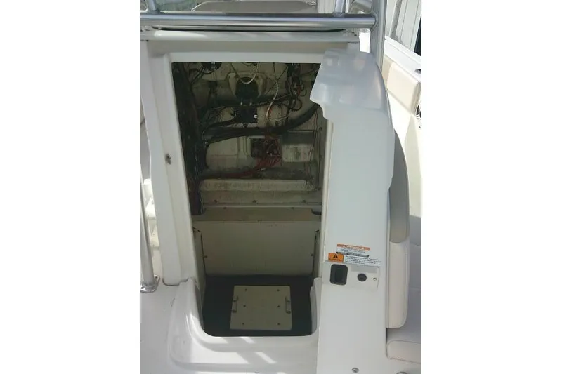 Slide: The Image of 2016 Robalo R200 Center Console boat interior wiring and storage compartment. - 23