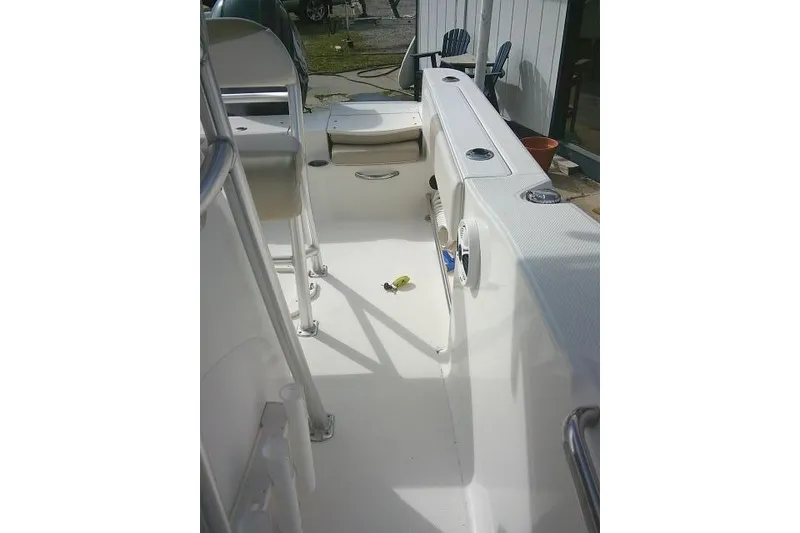 Slide: The Image of 2016 Robalo R200 Center Console boat interior with seating and storage. - 24