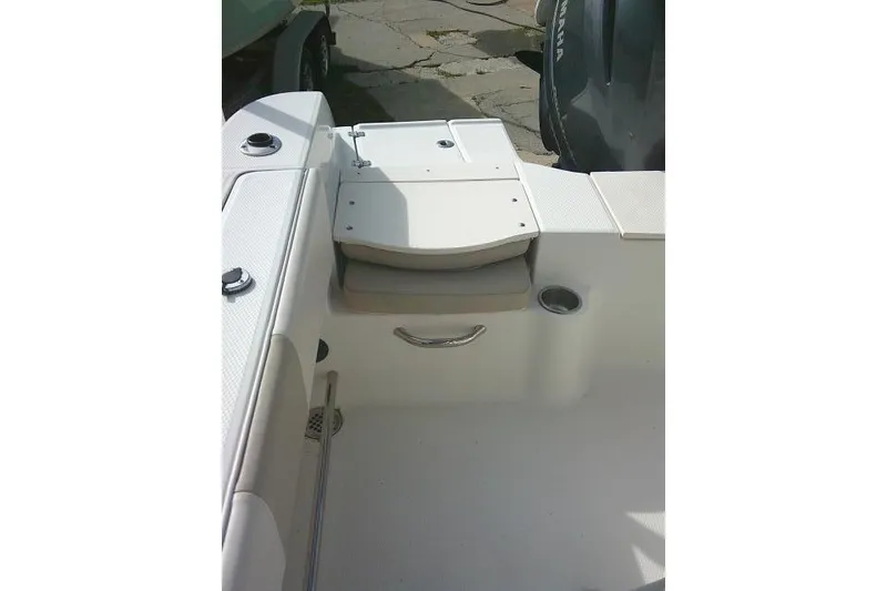 Slide: The Image of 2016 Robalo R200 Center Console boat interior with seating and storage. - 28