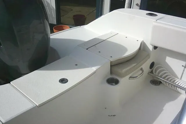 Slide: The Image of 2016 Robalo R200 Center Console boat interior with seating and storage compartments. - 29