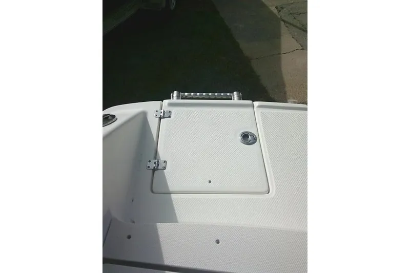 Slide: The Image of 2016 Robalo R200 Center Console boat deck with storage compartment. - 30
