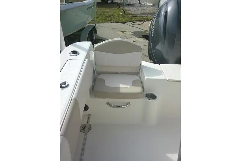 Slide: The Image of 2016 Robalo R200 Center Console boat interior with seating and cup holder. - 31