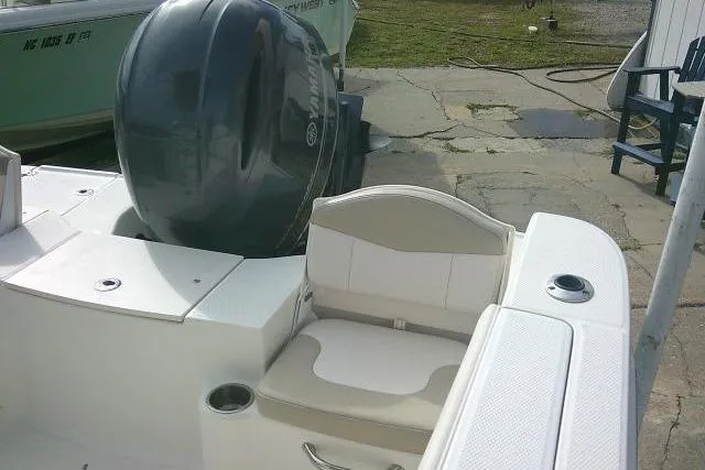 Slide: The Image of 2016 Robalo R200 Center Console boat with seating and outboard motor. - 34