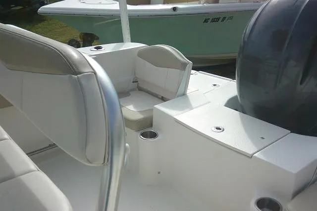 Slide: The Image of 2016 Robalo R200 Center Console boat interior with seating and engine view. - 35