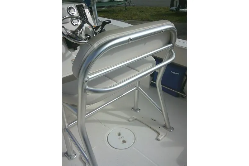 Slide: The Image of 2016 Robalo R200 Center Console boat helm with stainless steel rail and steering wheel. - 37