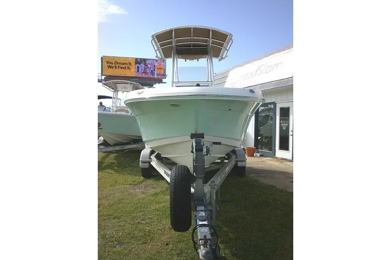Slide: The Image of 2016 Robalo R200 Center Console boat on trailer, displayed outdoors. - 4