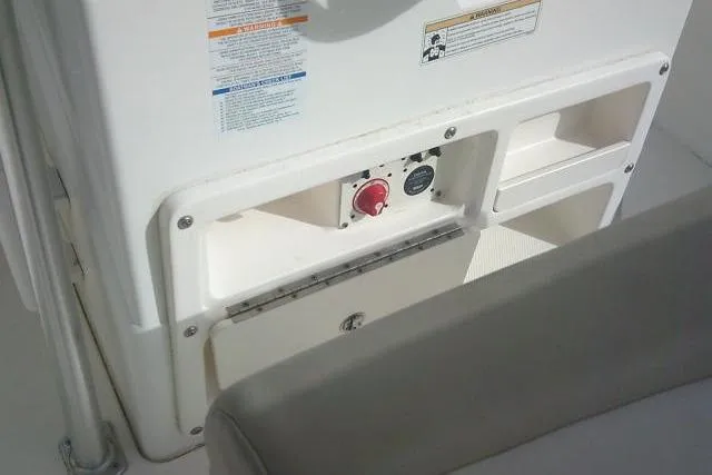 Slide: The Image of 2016 Robalo R200 Center Console boat interior with storage compartments and control panel. - 40