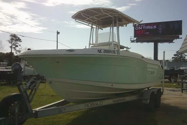Slide: The Image of 2016 Robalo R200 Center Console boat on trailer, parked outdoors. - 5