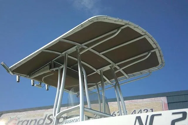 Slide: The Image of 2016 Robalo R200 Center Console boat with T-top against blue sky. - 6